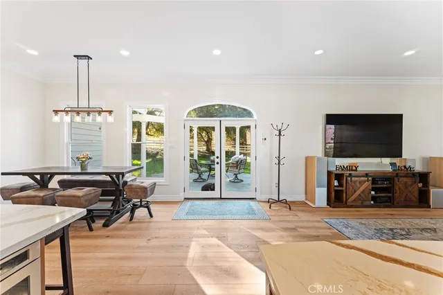 a kitchen with stainless steel appliances granite countertop a sink and a refrigerator