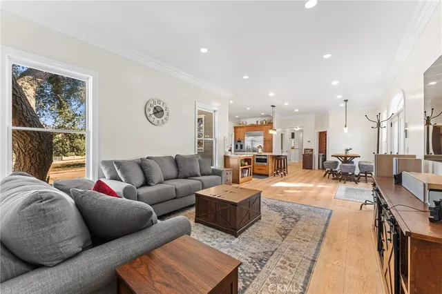 a view of a hallway with wooden floor and closet