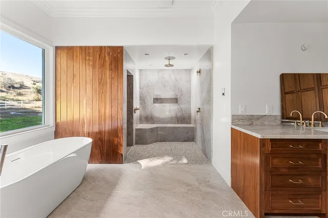 a spacious bedroom with a bed and a ceiling fan