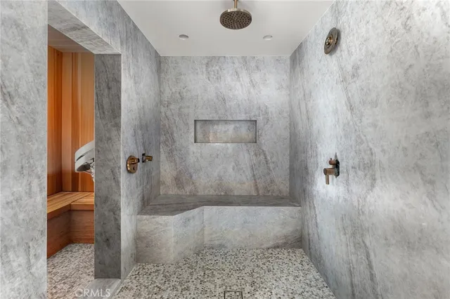 a bedroom with a bed and a chair