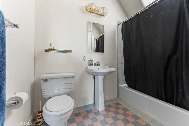 a view of a town with mountains in the background