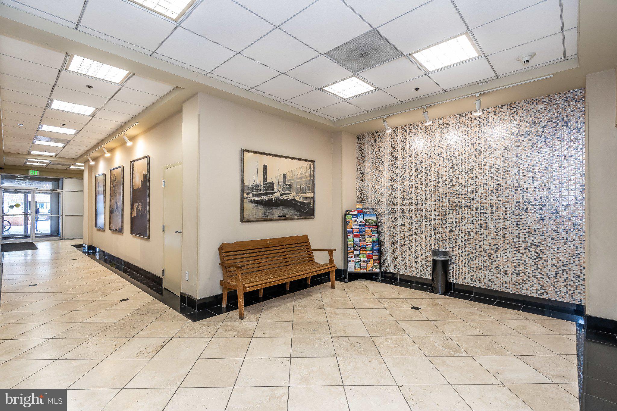 2702 Lighthouse Point East, Unit 532 Baltimore, MD 21224 - Photo 32 of 41 Inviting lobby with artistic flair.