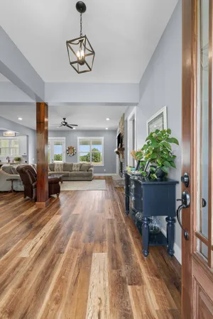 a view of a living room and a livingroom with furniture wooden floor