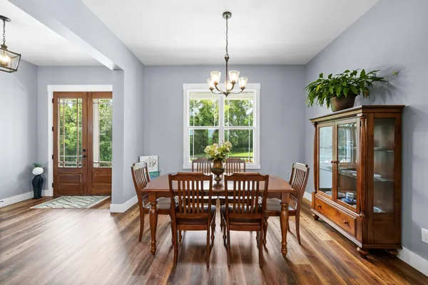 a view of a dining room with furniture window and wooden floor