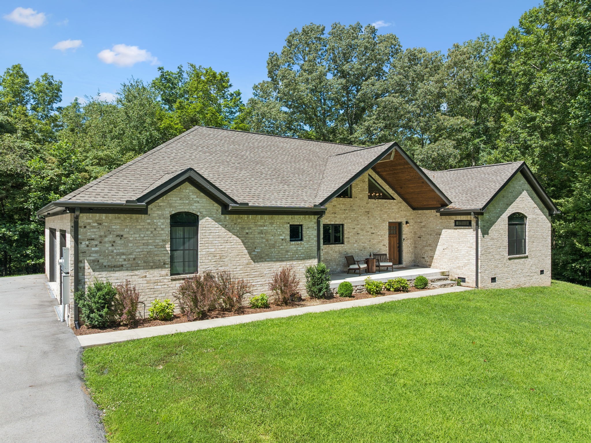 7903 Daugherty-Capley Road Primm Springs, TN 38476 - Photo 2 of 92 a front view of a house with a yard and garage