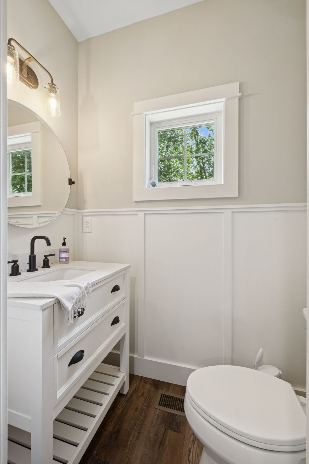 7903 Daugherty-Capley Road Primm Springs, TN 38476 - Photo 46 of 92 a bathroom with a sink a toilet and a window
