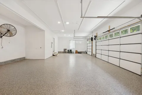 a backyard of a house with lots of green space and garden