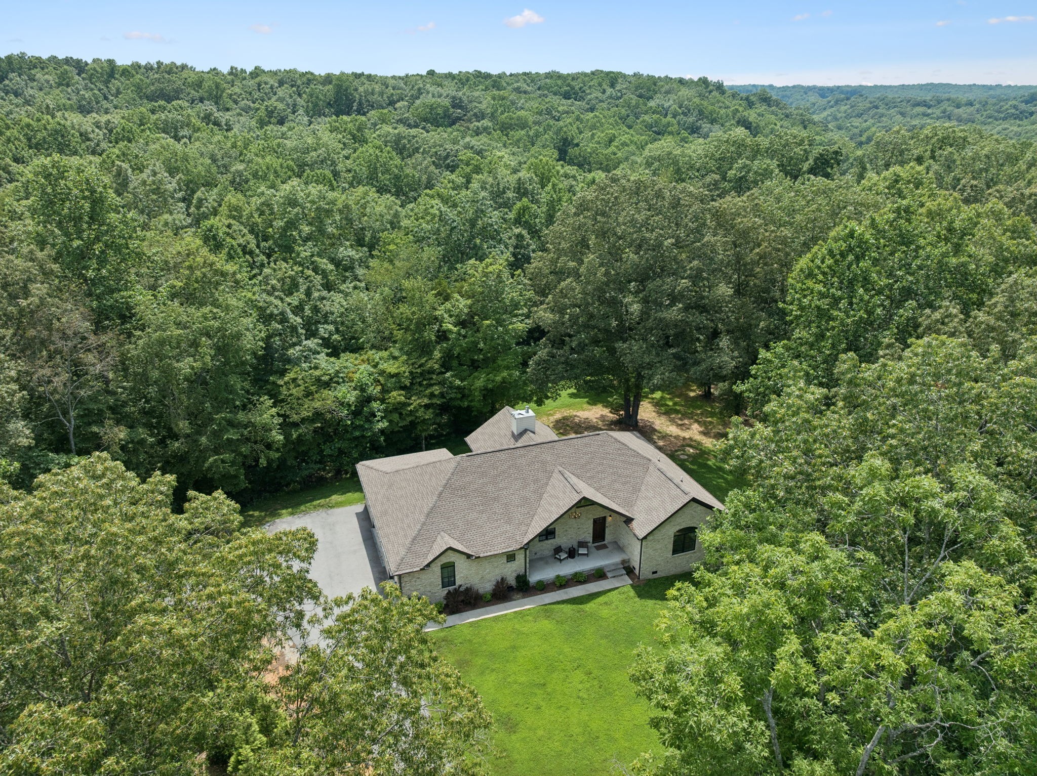 7903 Daugherty-Capley Road Primm Springs, TN 38476 - Photo 68 of 92 an aerial view of a house with yard and outdoor seating