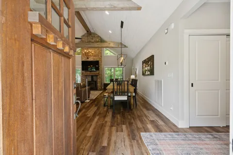 a living room with fireplace furniture and a flat screen tv