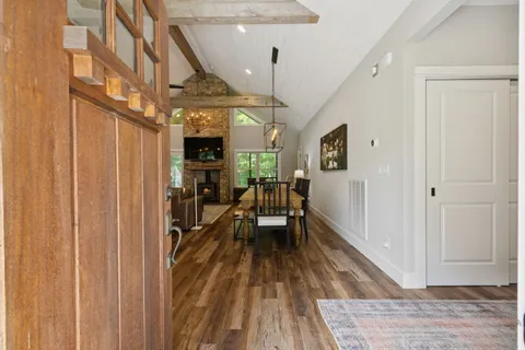 a living room with fireplace furniture and a flat screen tv