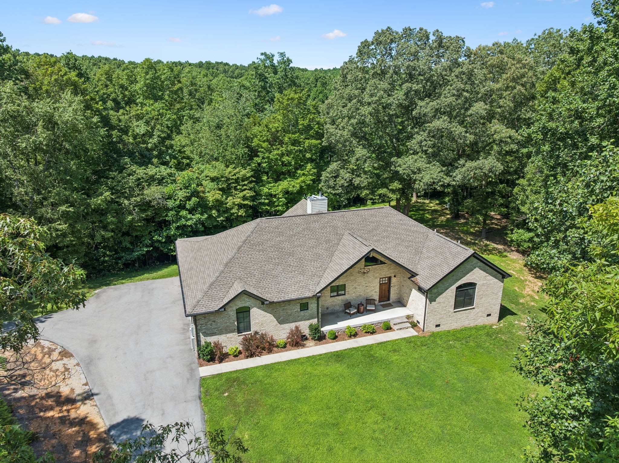 7903 Daugherty-Capley Road Primm Springs, TN 38476 - Photo 91 of 92 an aerial view of a house with yard and trees in the background