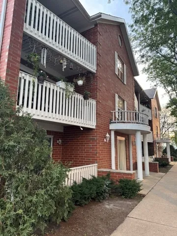 a view of a house with backyard and porch