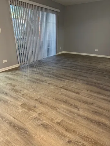 a kitchen with a stove a sink and a microwave