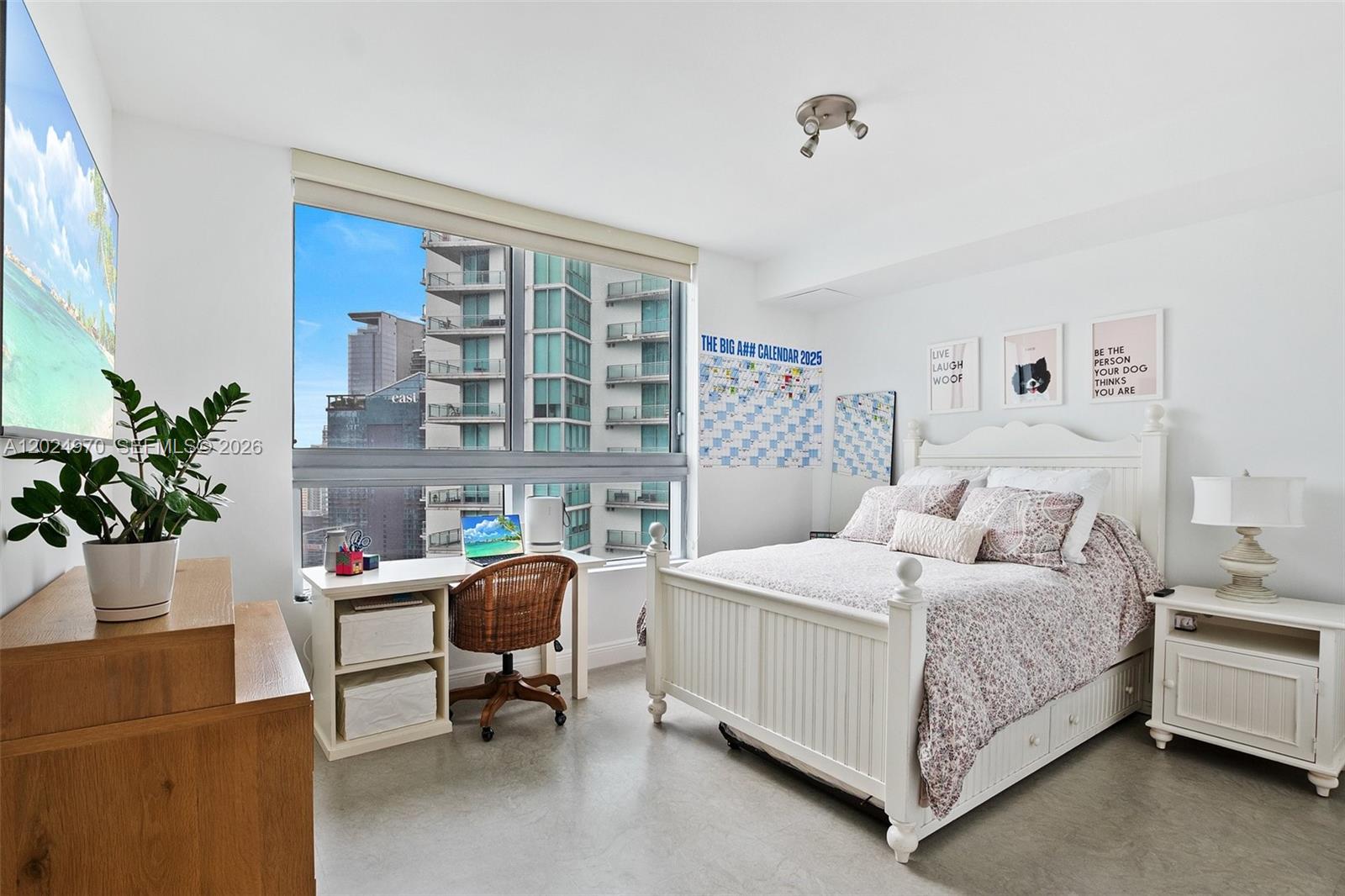 90 Southwest 3rd Street, Unit 3810 Miami, FL 33130 - Photo 23 of 45 a bedroom with a bed chair and a potted plant