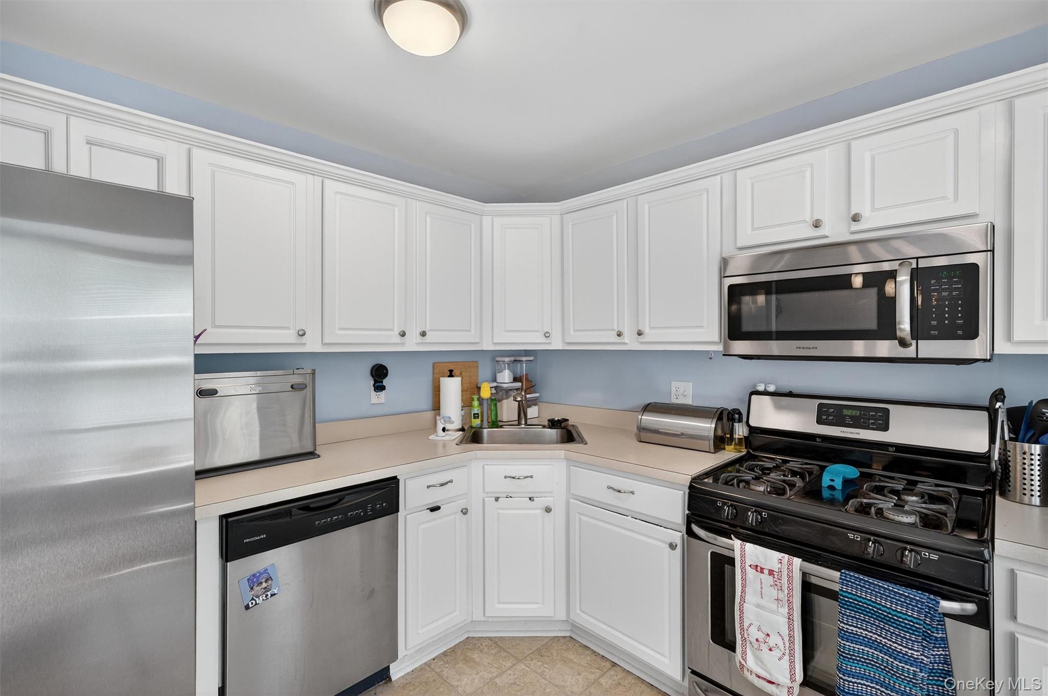 1 Lake Ridge Drive Middletown, NY 10940 - Photo 14 of 44 a kitchen with granite countertop a stove sink and cabinets