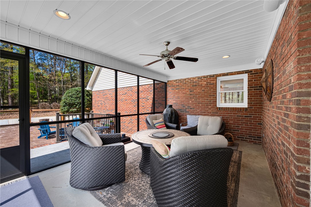1010 Ridgeview Drive Pendleton, SC 29670 - Photo 23 of 47 This inviting patio area features a ceiling fan, providing comfort for outdoor relaxation.