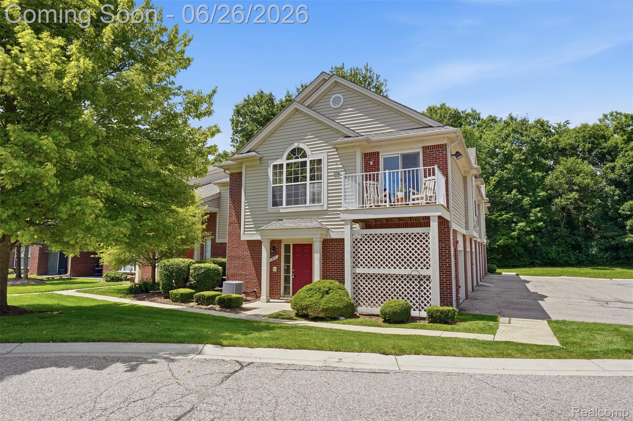 1668 Deepwood Circle Rochester, MI 48307 - Photo 3 of 27 Two-story property featuring brick and siding facade with a red entry door