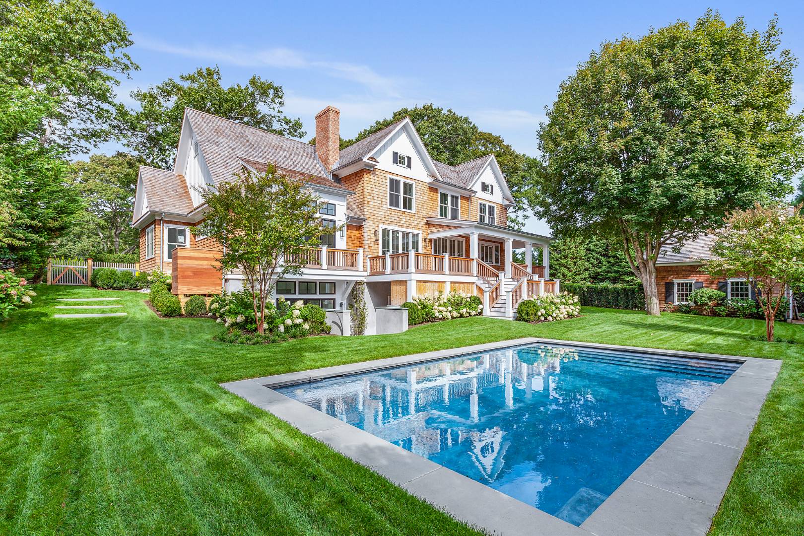 8 Greenway Drive East Hampton, NY 11937 - Photo 2 of 38 a view of a house with a swimming pool