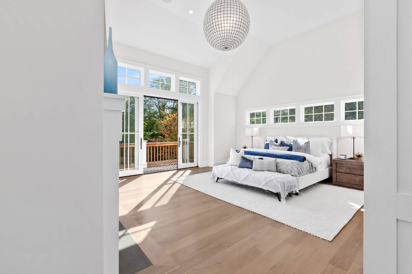 8 Greenway Drive East Hampton, NY 11937 - Photo 12 of 38 a bedroom with furniture and a large window