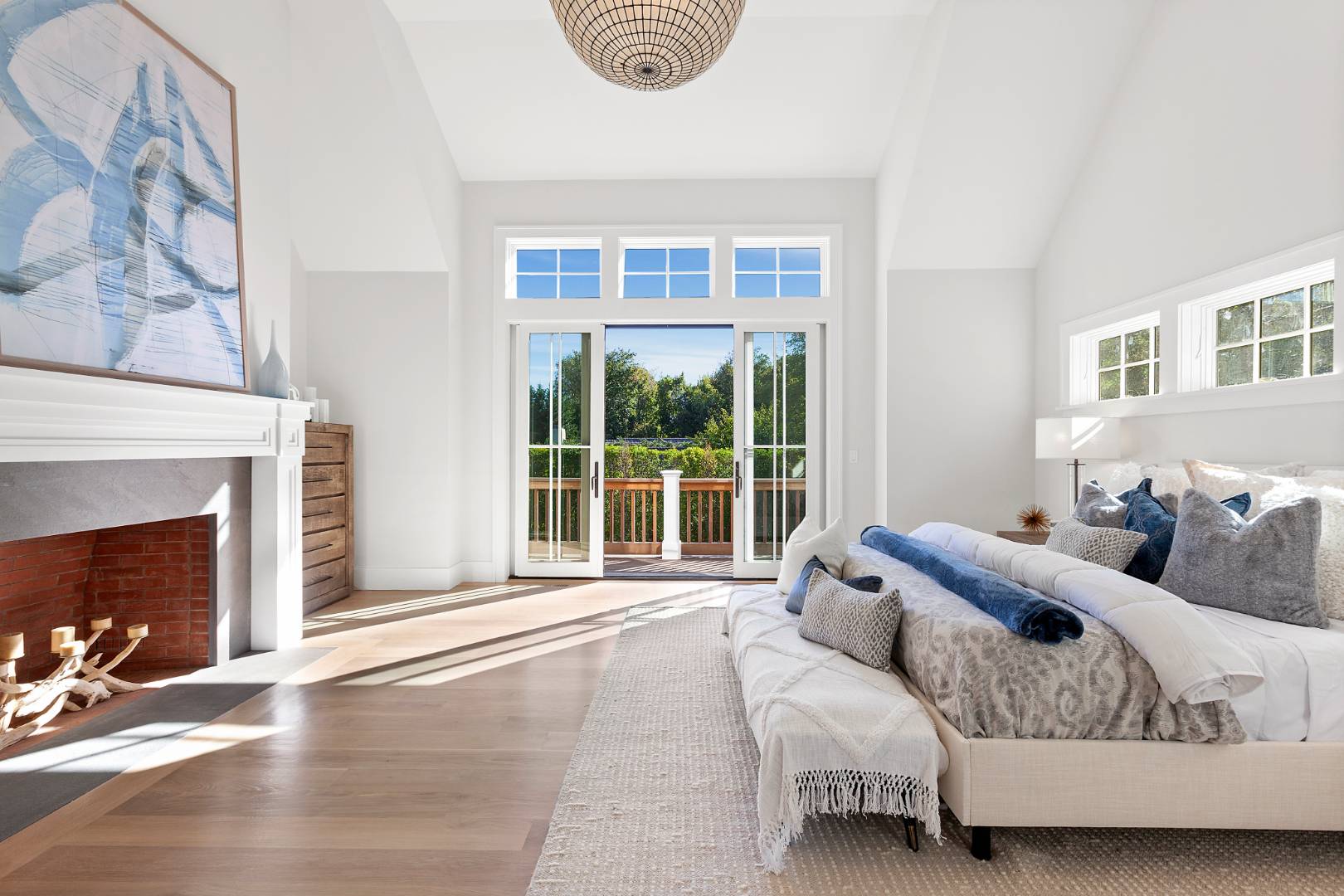 8 Greenway Drive East Hampton, NY 11937 - Photo 13 of 38 a spacious bedroom with a bed and a large window