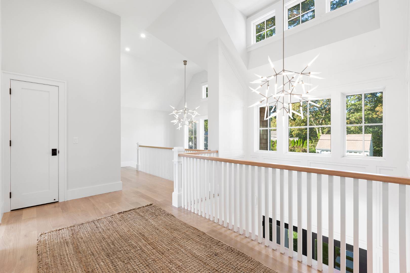 8 Greenway Drive East Hampton, NY 11937 - Photo 19 of 38 a view of a livingroom with wooden floor and chandelier