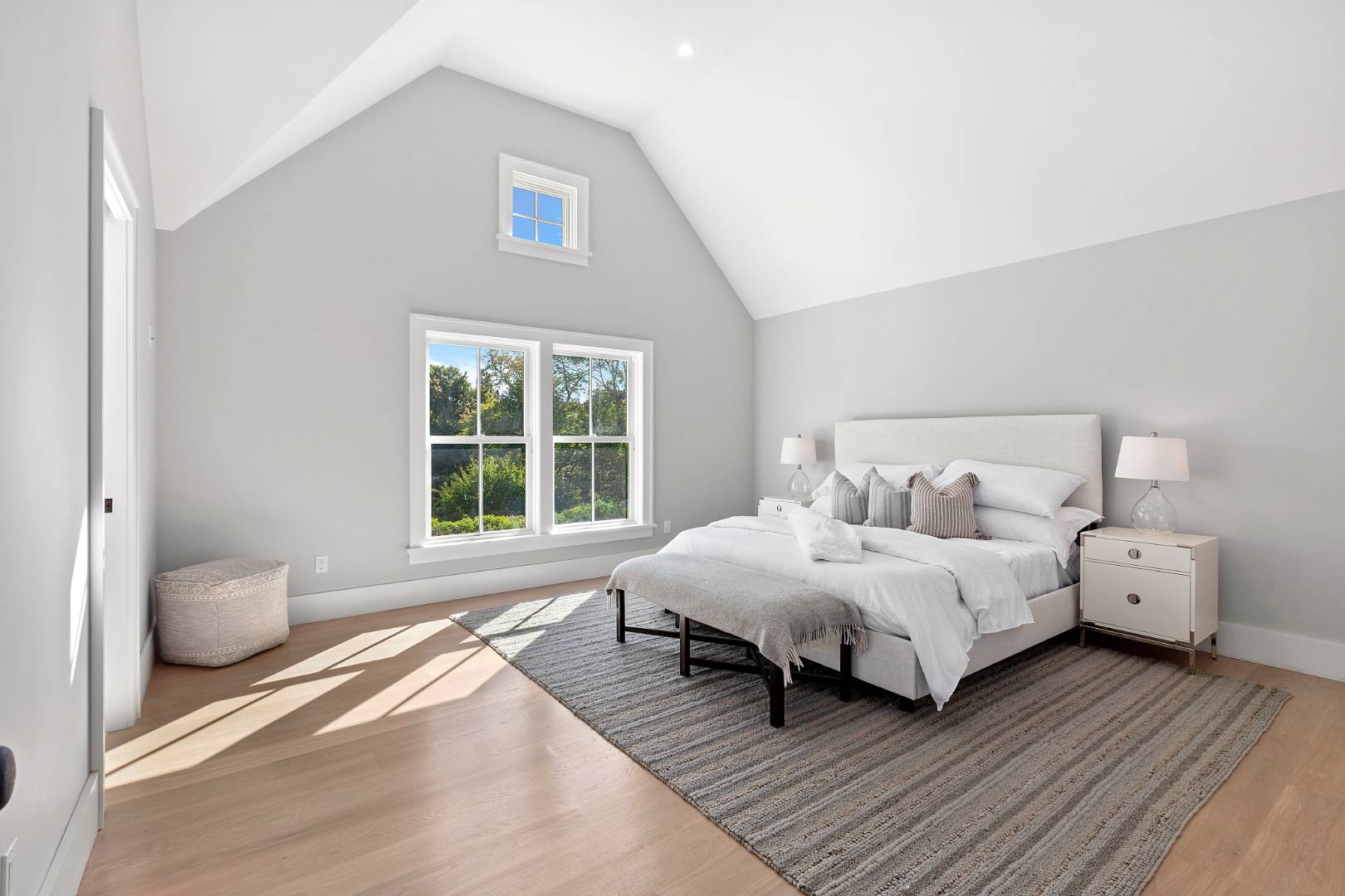 8 Greenway Drive East Hampton, NY 11937 - Photo 20 of 38 a bedroom with two beds and a large window