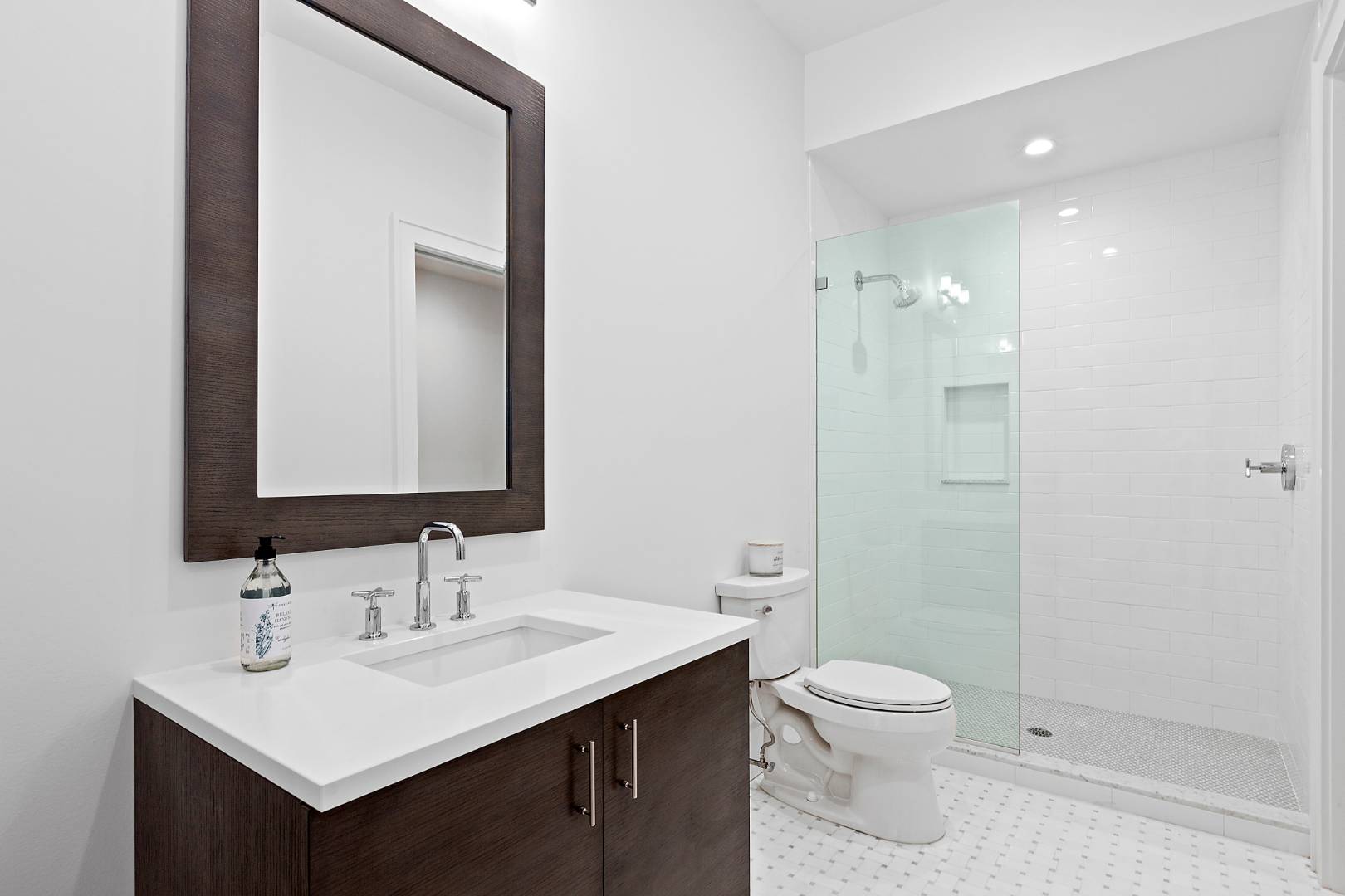 8 Greenway Drive East Hampton, NY 11937 - Photo 31 of 38 a bathroom with a sink toilet and shower