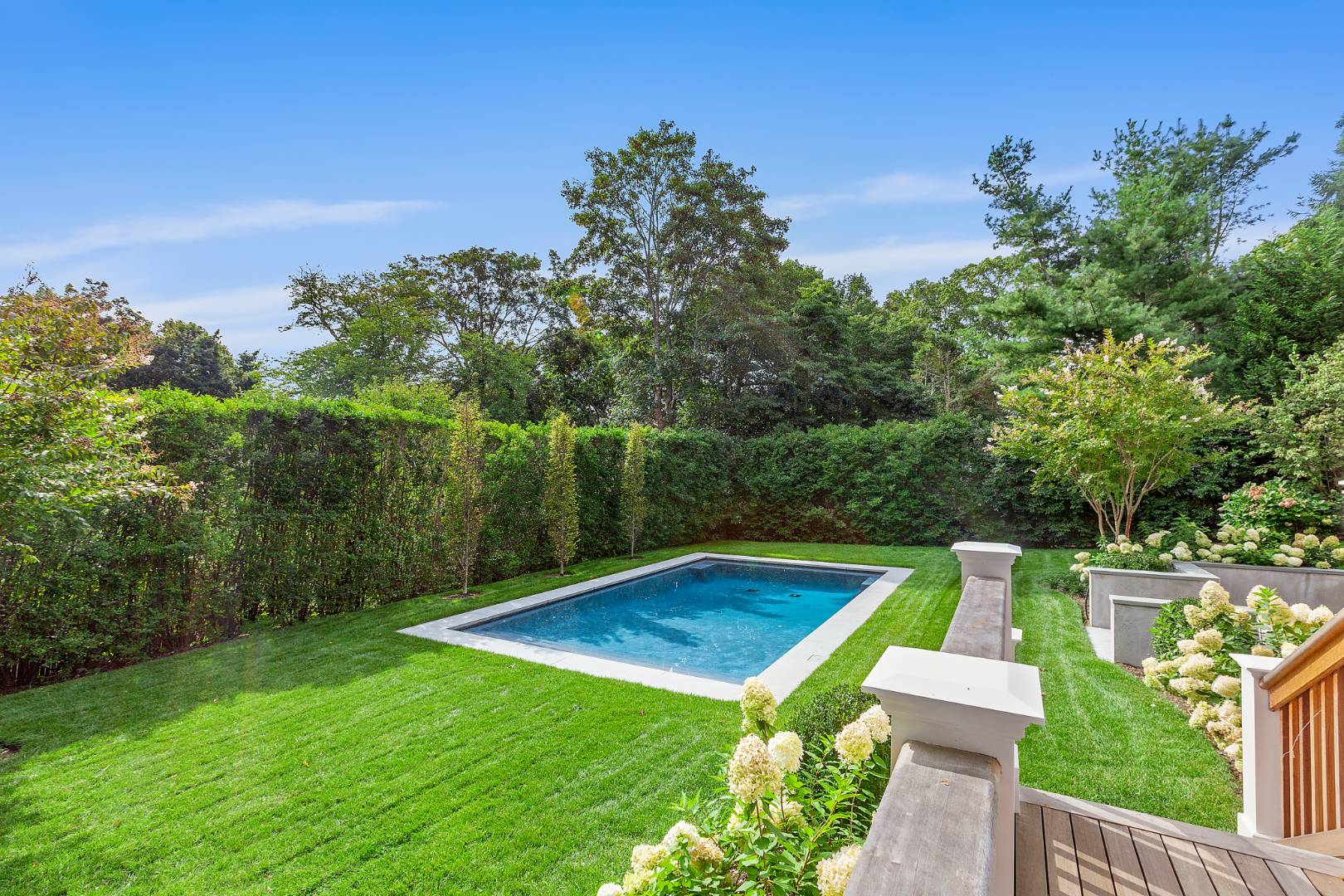 8 Greenway Drive East Hampton, NY 11937 - Photo 35 of 38 a view of a backyard with swimming pool