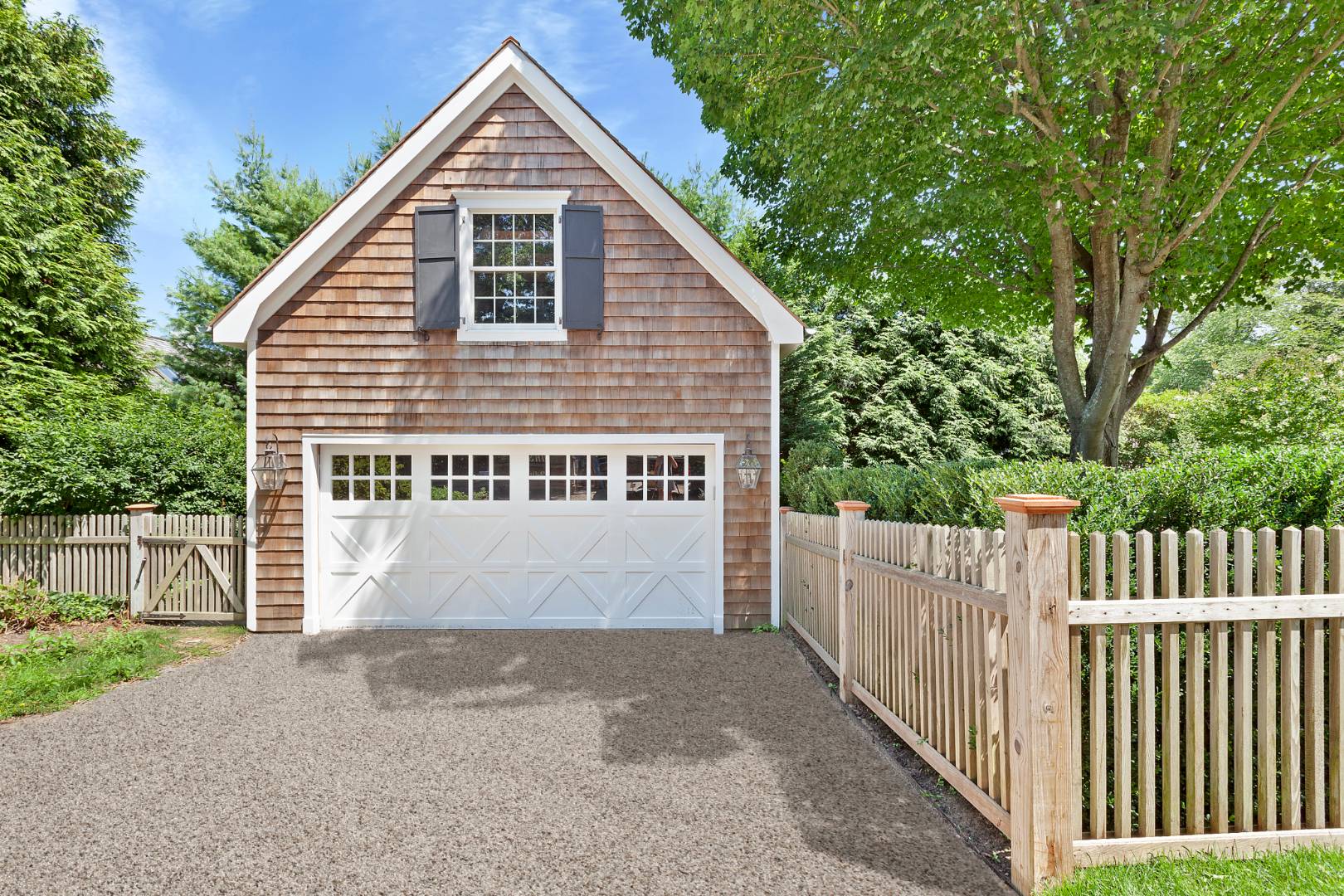 8 Greenway Drive East Hampton, NY 11937 - Photo 37 of 38 a view of a house with wooden fence next to a yard