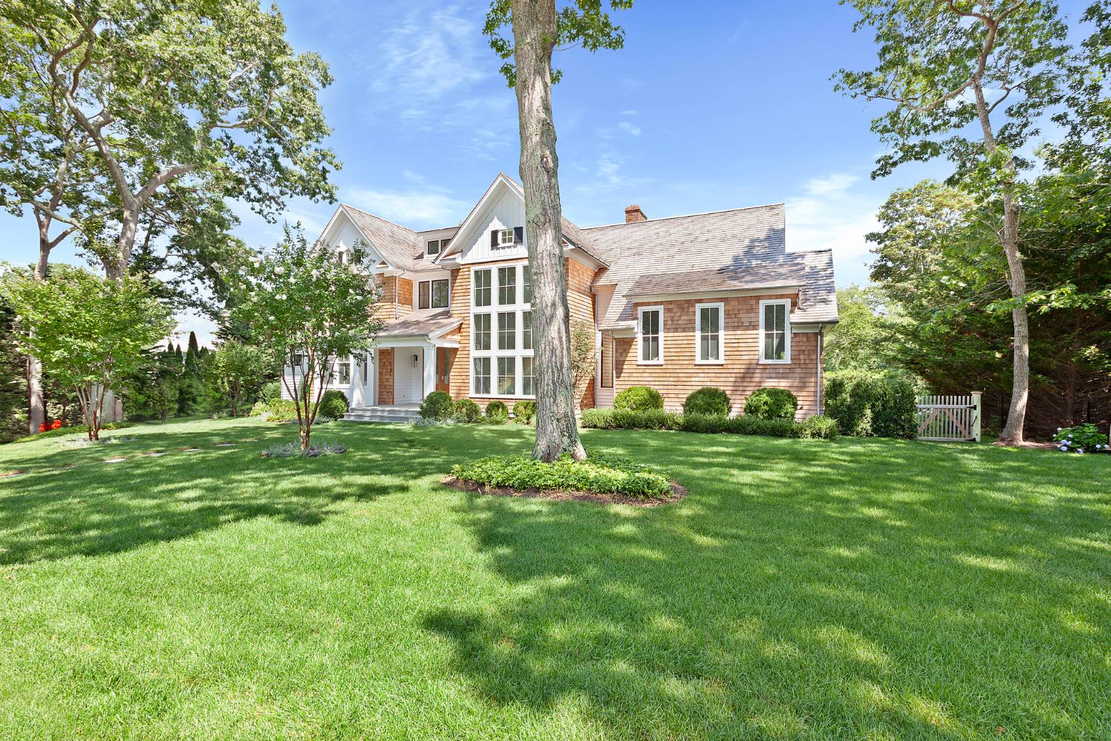 8 Greenway Drive East Hampton, NY 11937 - Photo 38 of 38 a front view of a house with a yard