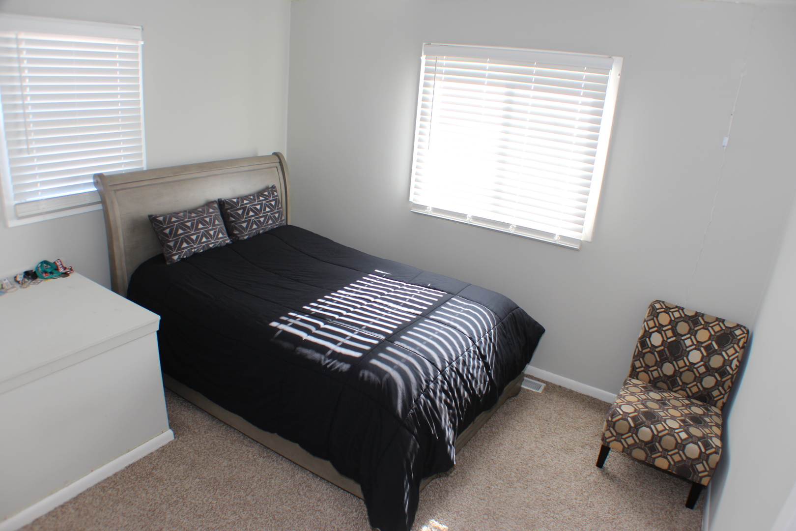 5113 44th Avenue Moline, IL 61265 - Photo 12 of 30 a bedroom with a bed and a window
