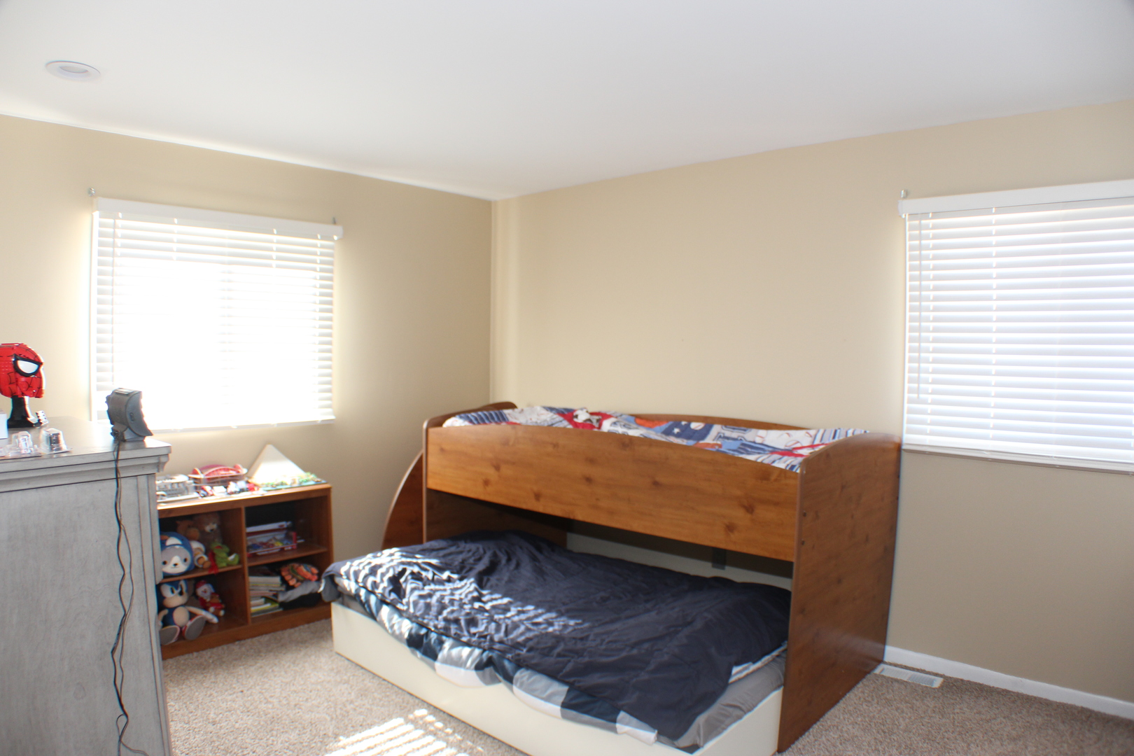 5113 44th Avenue Moline, IL 61265 - Photo 13 of 30 a bed sitting in a bedroom next to a window