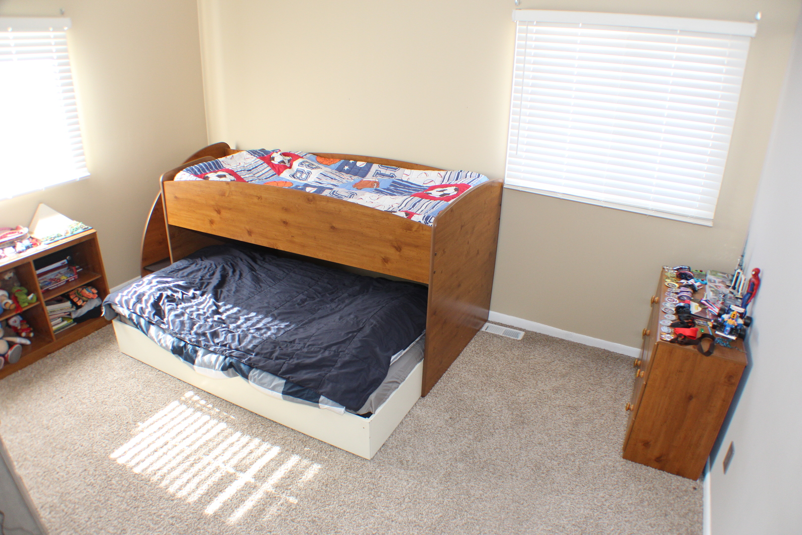5113 44th Avenue Moline, IL 61265 - Photo 14 of 30 a bed sitting in a bedroom next to a window