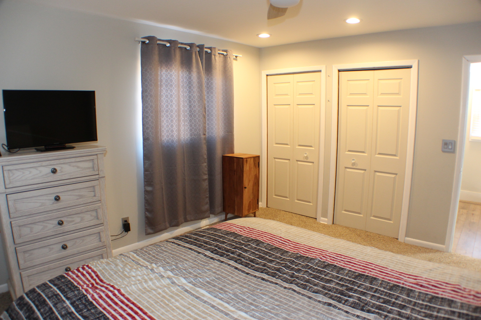 5113 44th Avenue Moline, IL 61265 - Photo 17 of 30 a bedroom with a bed and a flat screen tv