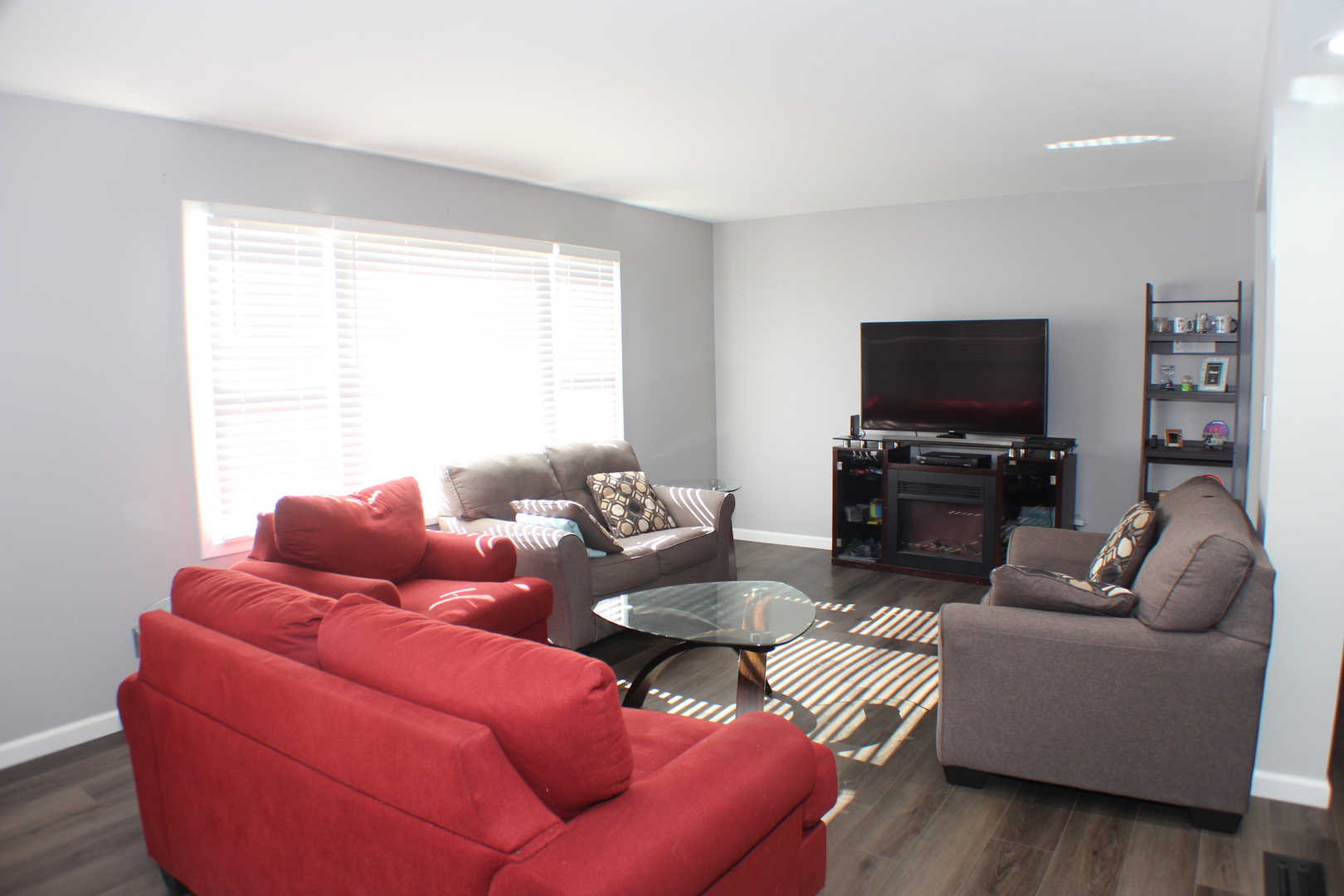 5113 44th Avenue Moline, IL 61265 - Photo 3 of 30 a living room with furniture and a flat screen tv