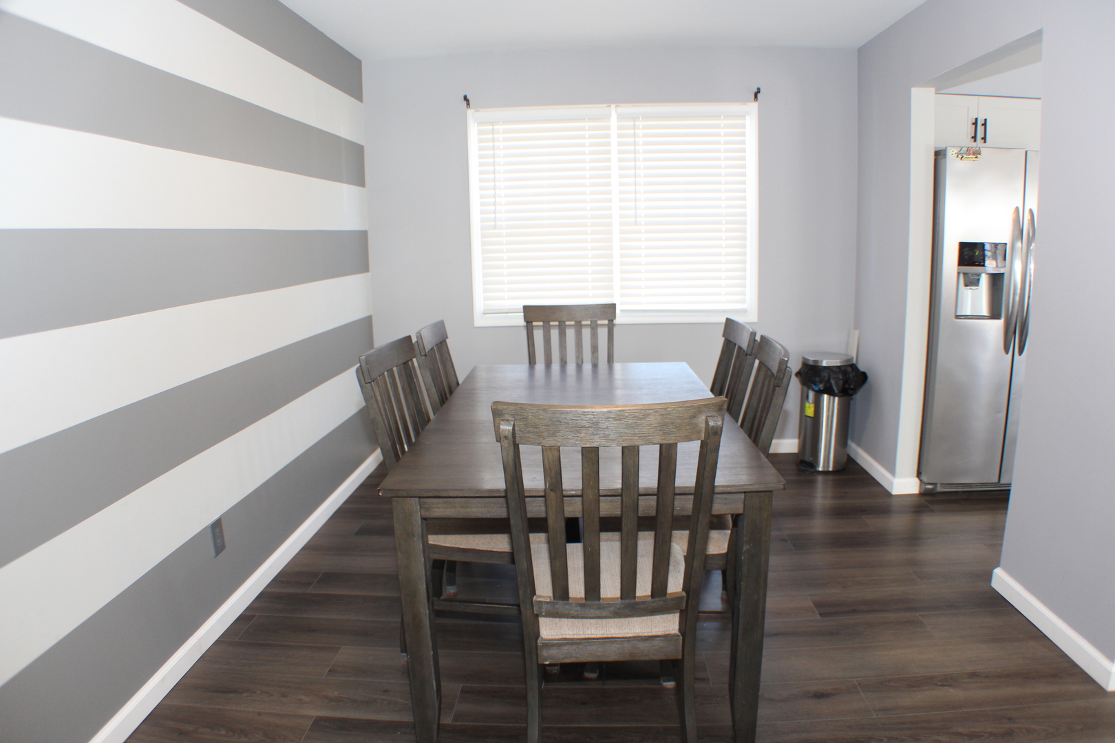 5113 44th Avenue Moline, IL 61265 - Photo 5 of 30 a view of a dining room with furniture window and wooden floor