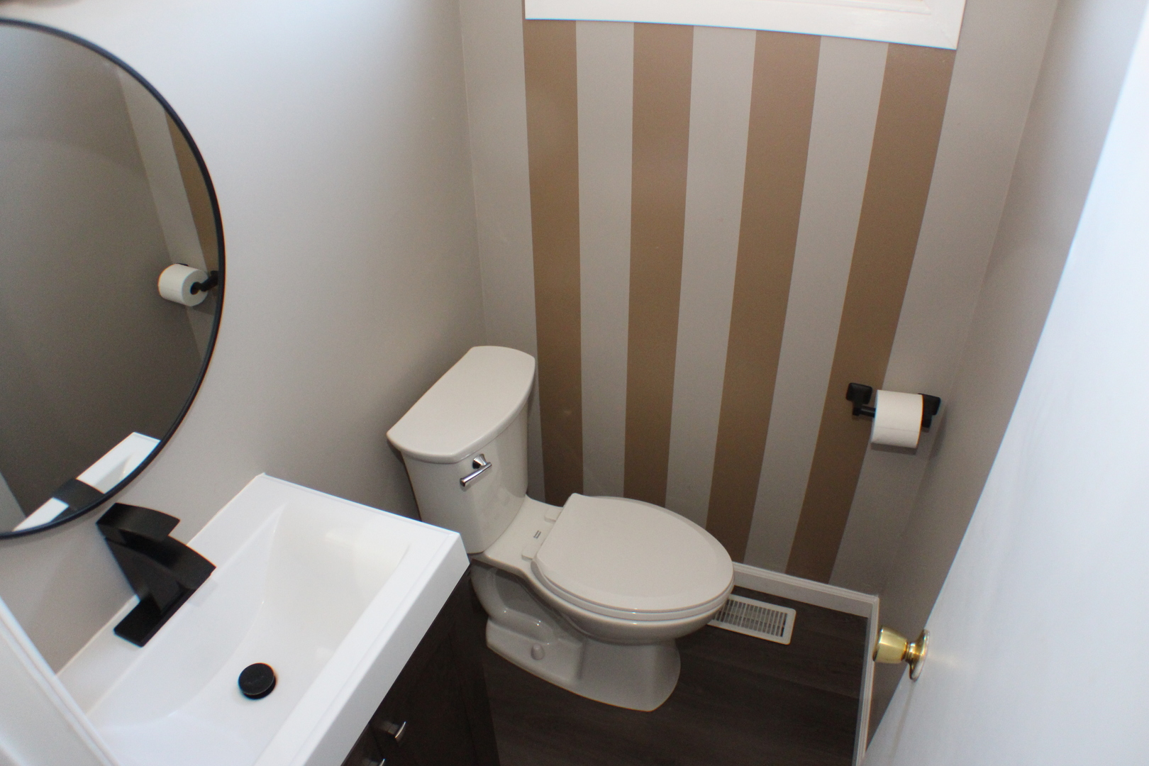5113 44th Avenue Moline, IL 61265 - Photo 10 of 30 a white toilet sitting next to a white sink