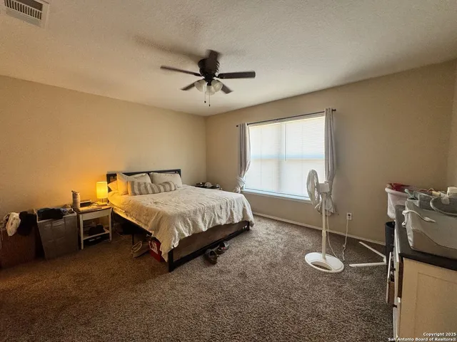 a living room with furniture and white walls
