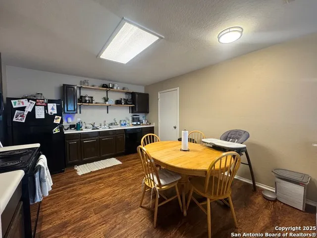 a kitchen with a table and chairs in it