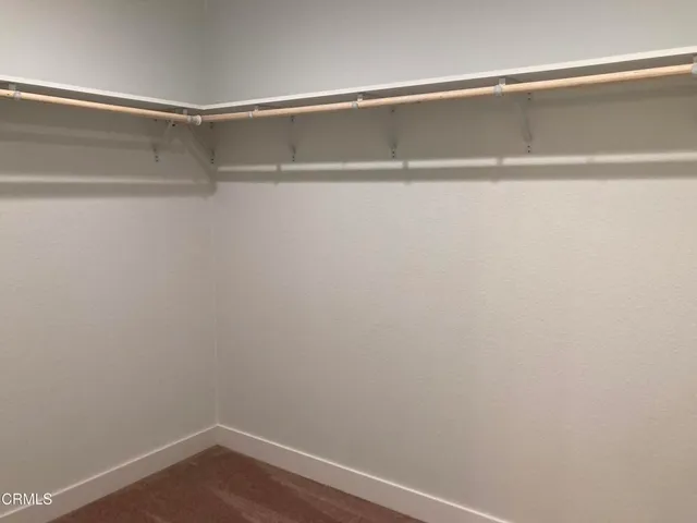 a bathroom with a shower sink and mirror