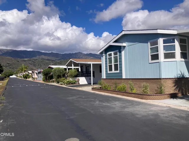 a view of a house with a street