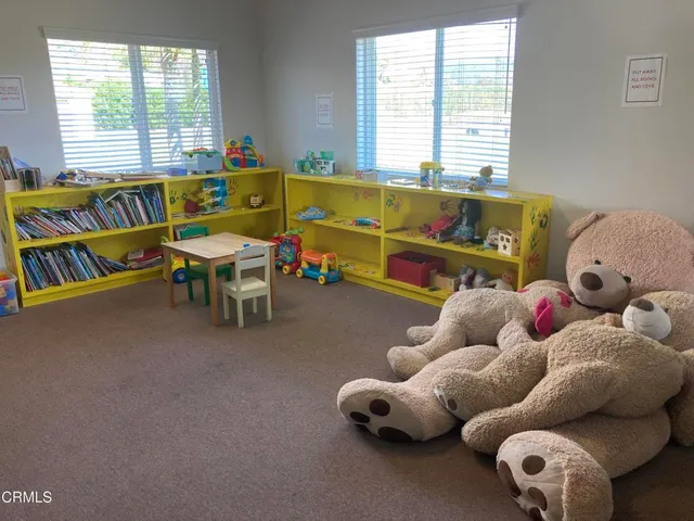 a kitchen with a stove and a white cabinets
