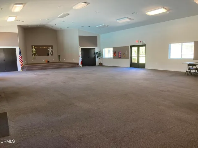 a view of a house with swimming pool and sitting area