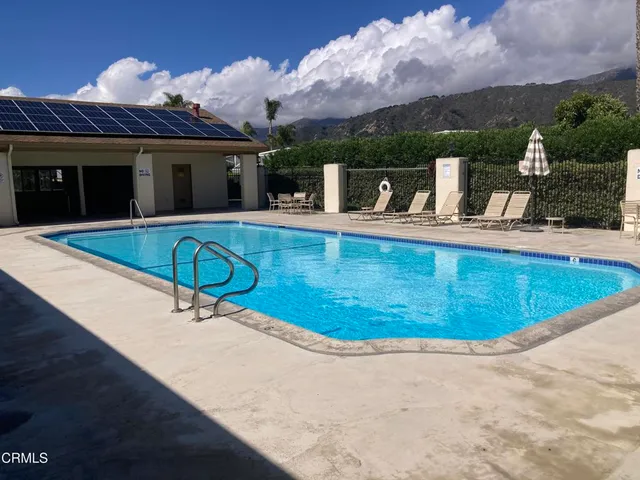 a kitchen with a sink cabinets and wooden floor