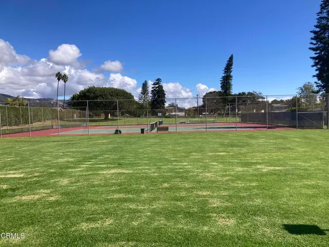 a room with gym equipment and a large window