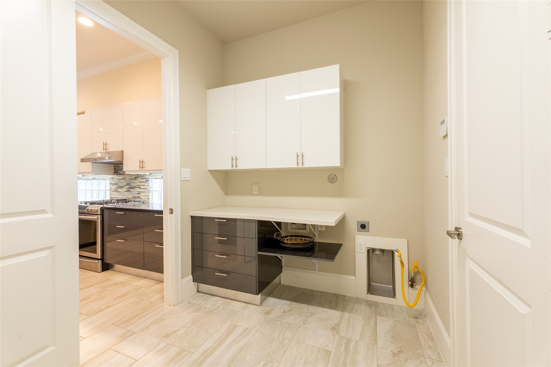 25718 Muirfield Bend Court Spring, TX 77389 - Photo 20 of 50 a view of kitchen with wooden floor and electronic appliances