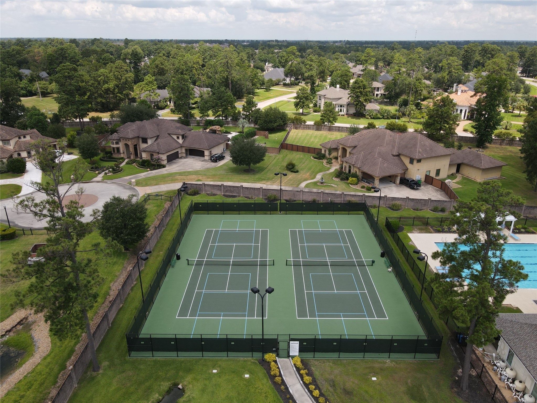 25718 Muirfield Bend Court Spring, TX 77389 - Photo 46 of 50 a view of a tennis court