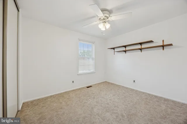 a view of a room with rack and fan