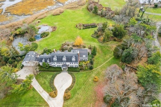 a aerial view of a house with a garden and swimming pool