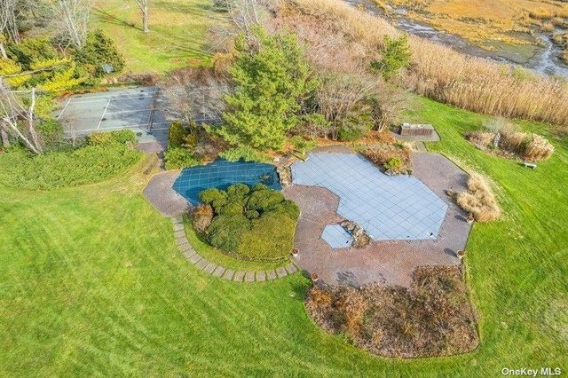 a view of a swimming pool with a yard